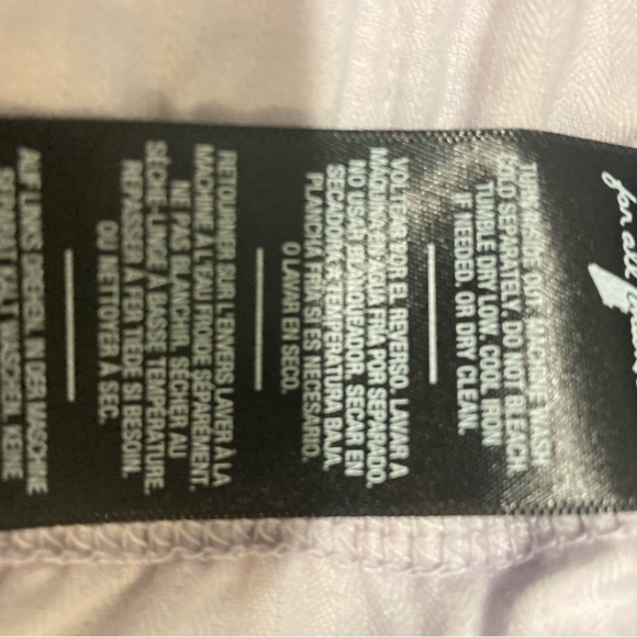 Mid Roll Shorts 7 for all mankind. Size 30 in a light violet color  NWOT. Button - Picture 2 of 7